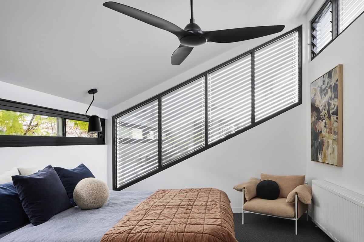 Interior view of some Asymmetric external venetian blinds outside of a bedroom