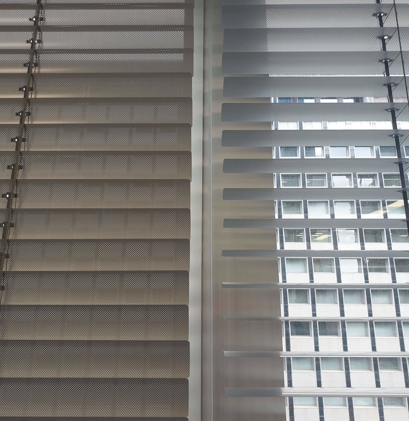 Perforated slats on venetian blinds