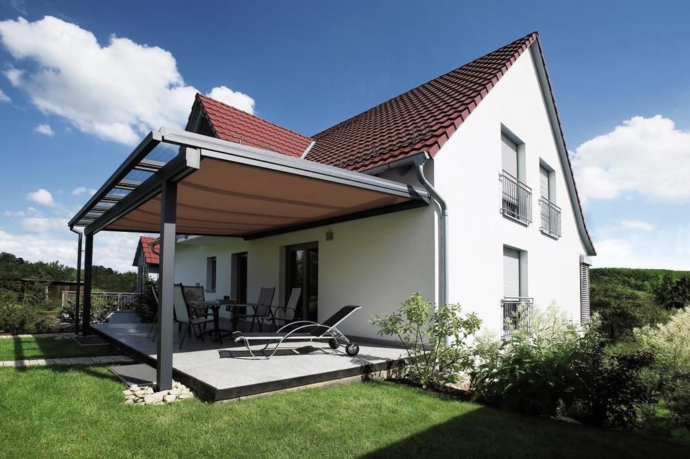 W10 Climara Conservatory Awning extended out over an outdoor entertainment area