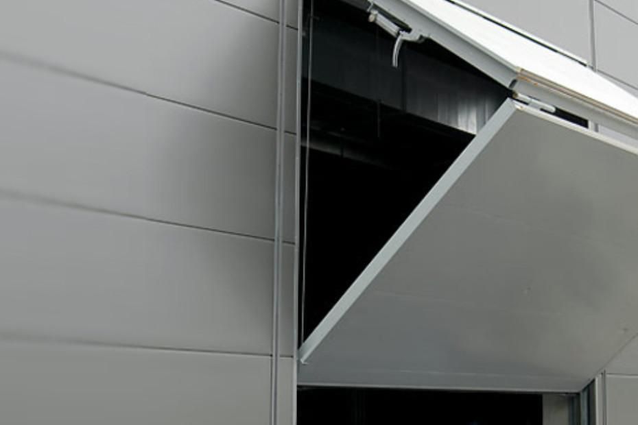 Closed Motorised Bi-Fold Blinds photographed on the exterior of a Melbourne commercial building 