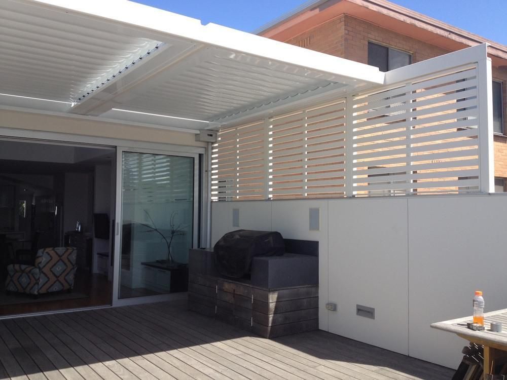Sunlite Elliptical Louvres closed over a deck in a residential house