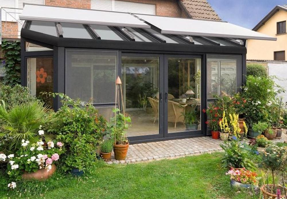 W7 Conservatory Awning providing shade over a glass roof