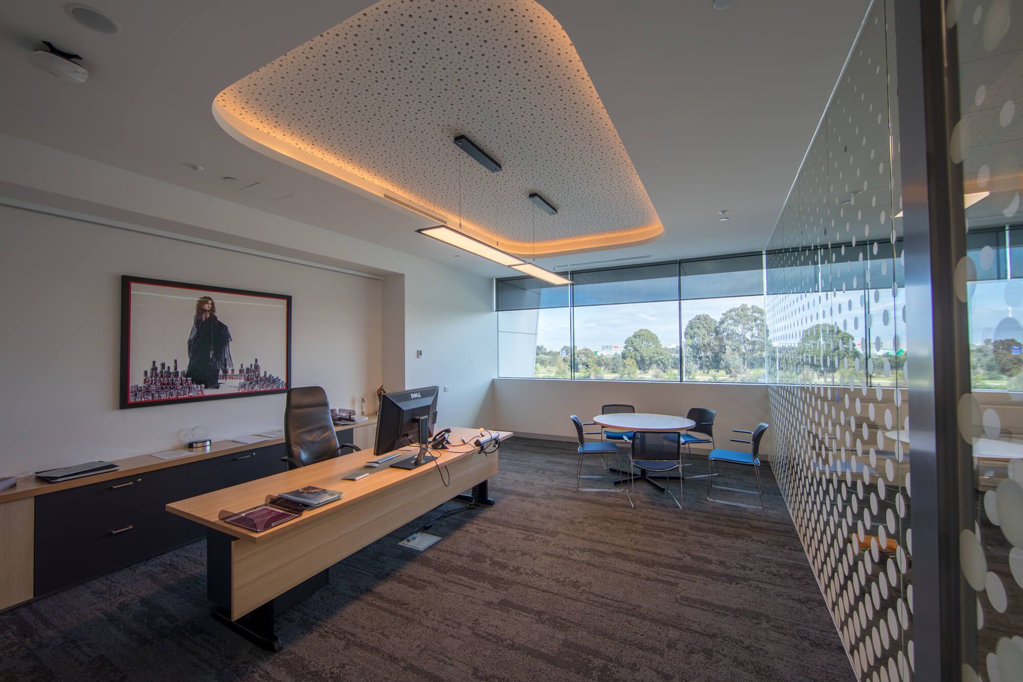 Internal roller blinds blocking out glare in a Melbourne office space