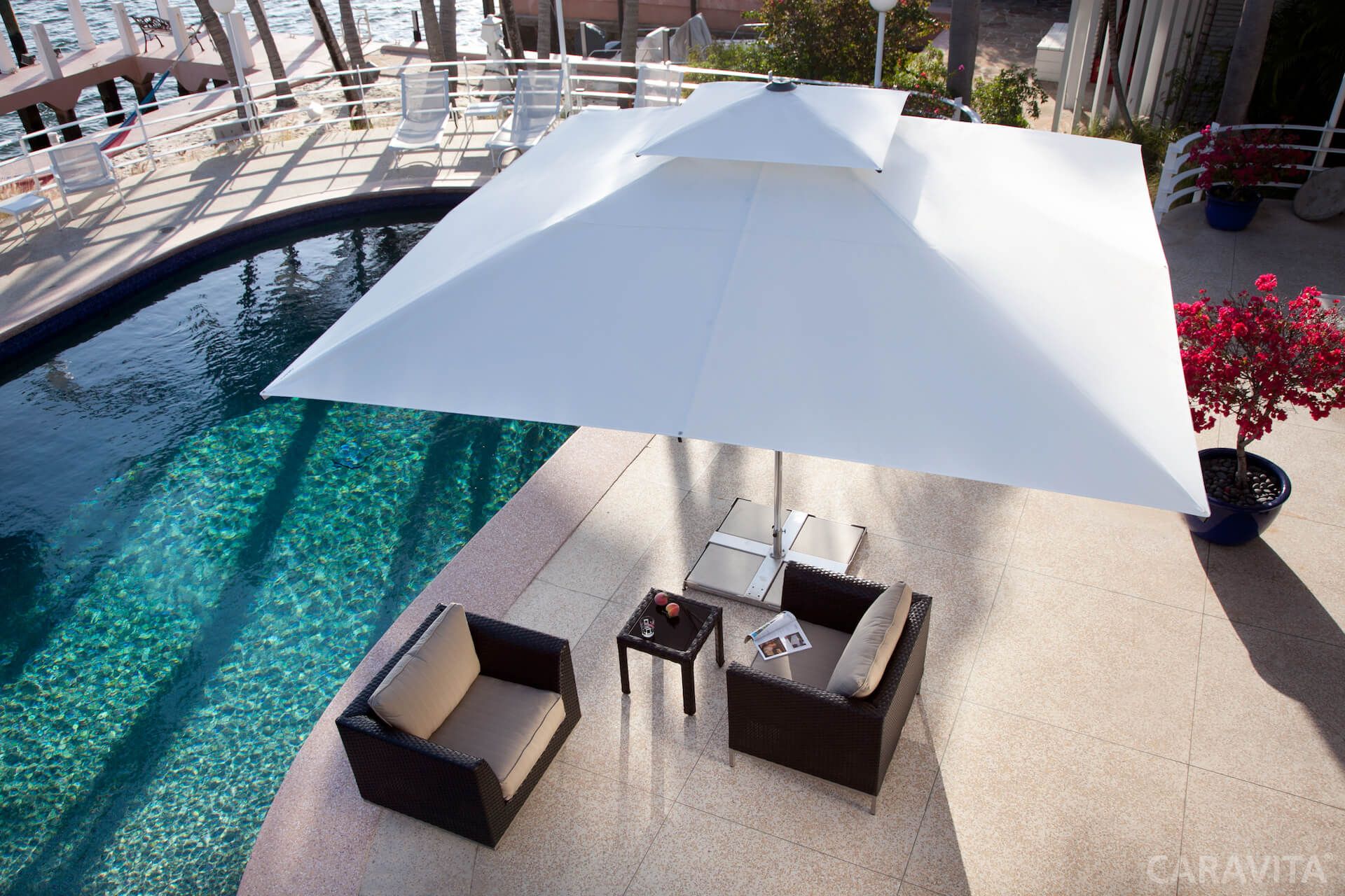 Supremo umbrella covering poolside area