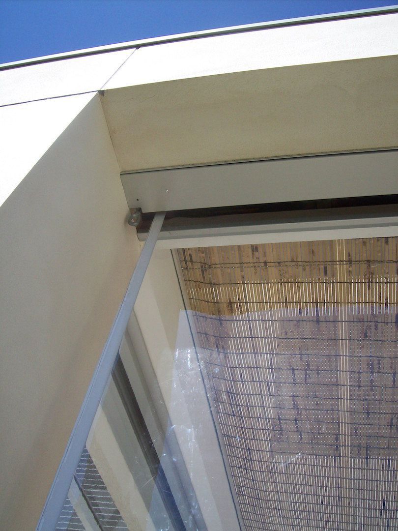 Vertical awning retracted into the pelmet