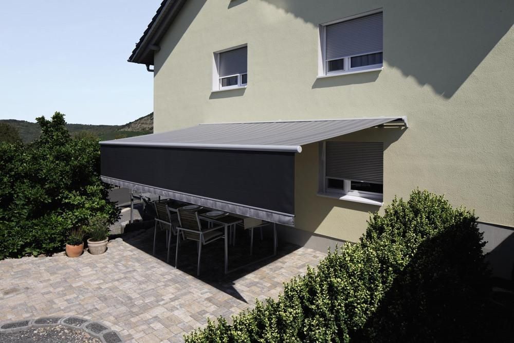 Semi Cassette Folding Arm awning opened over an outdoor area