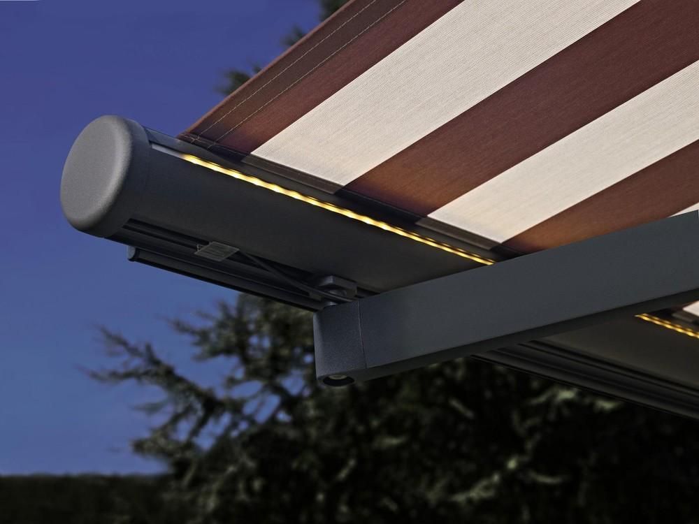 Semi-cassette Folding Arm awning extended with LED lights included