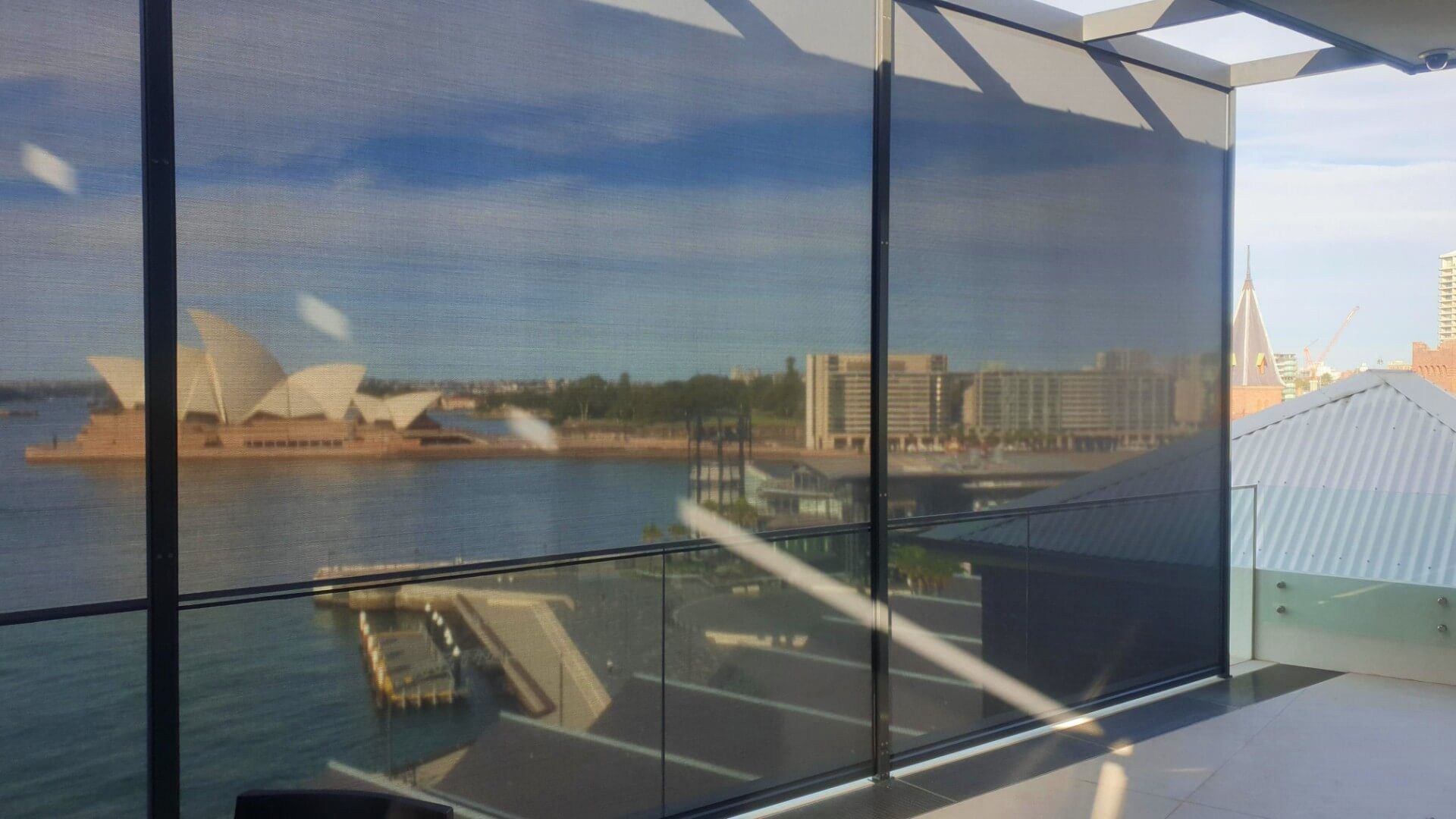 ZIP awnings installed on a balcony overlooking the Sydney Opera house in Sydney